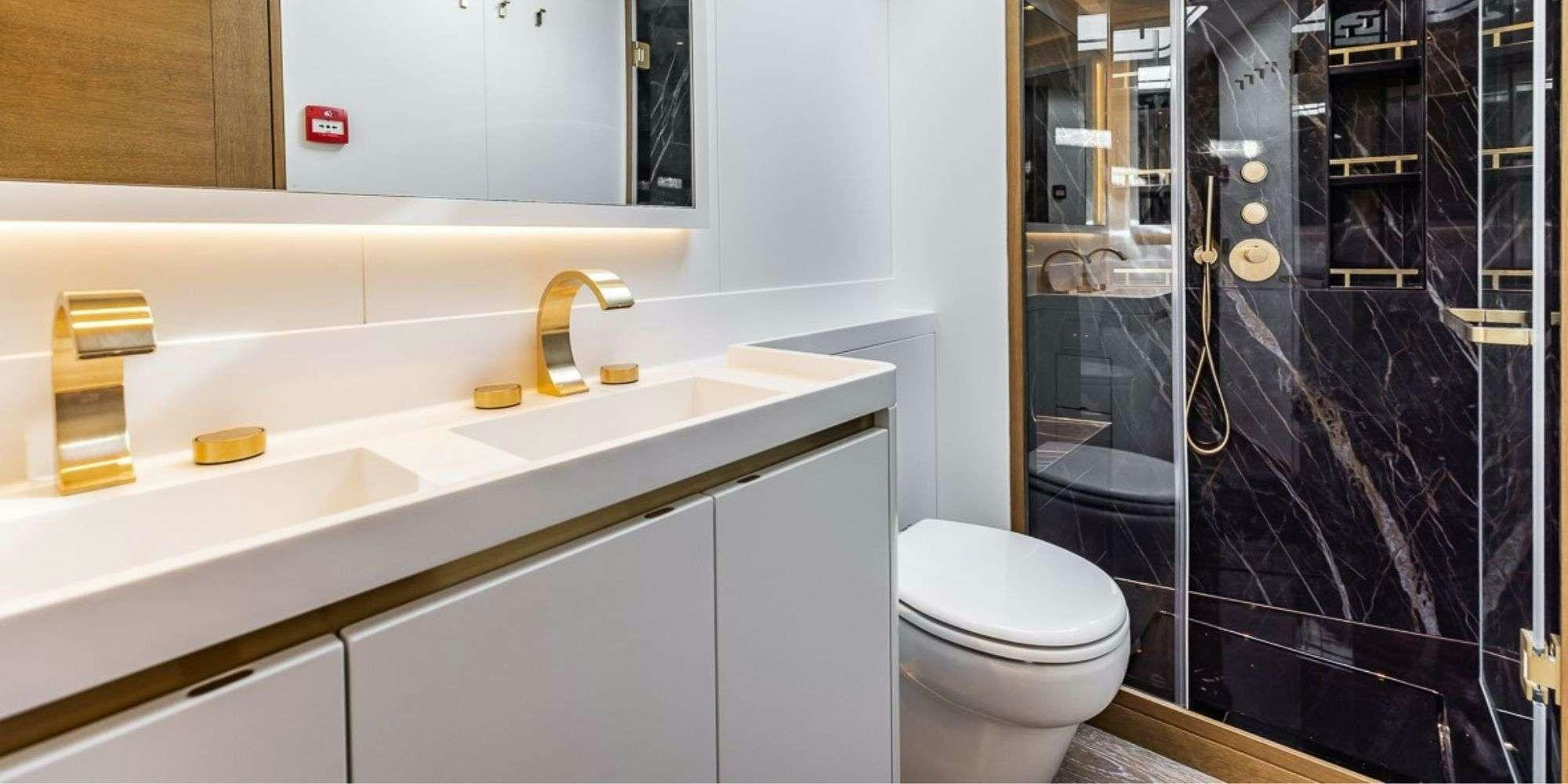a bathroom with a glass shower aboard FANCY Yacht for Charter