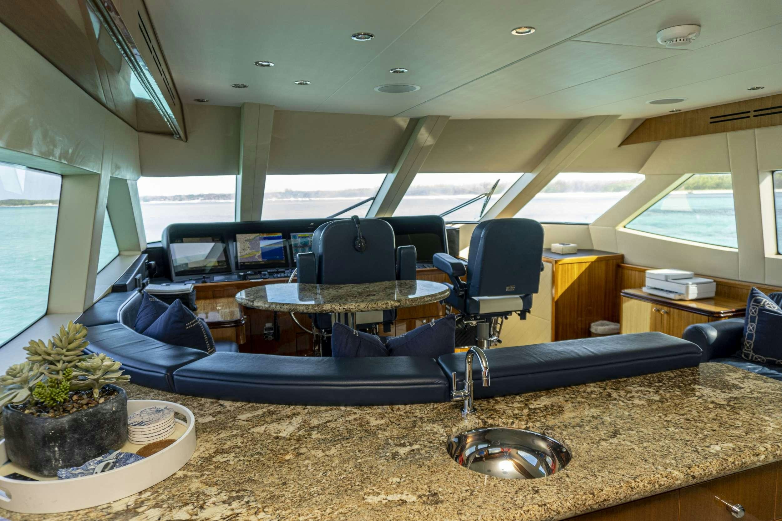 a room with a table and chairs aboard GAIL FORCE II Yacht for Charter