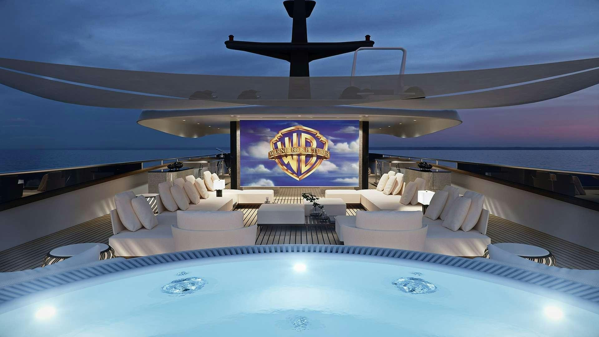 a large swimming pool with a large lounge chair and a large blue sky aboard BLACK SWAN Yacht for Charter