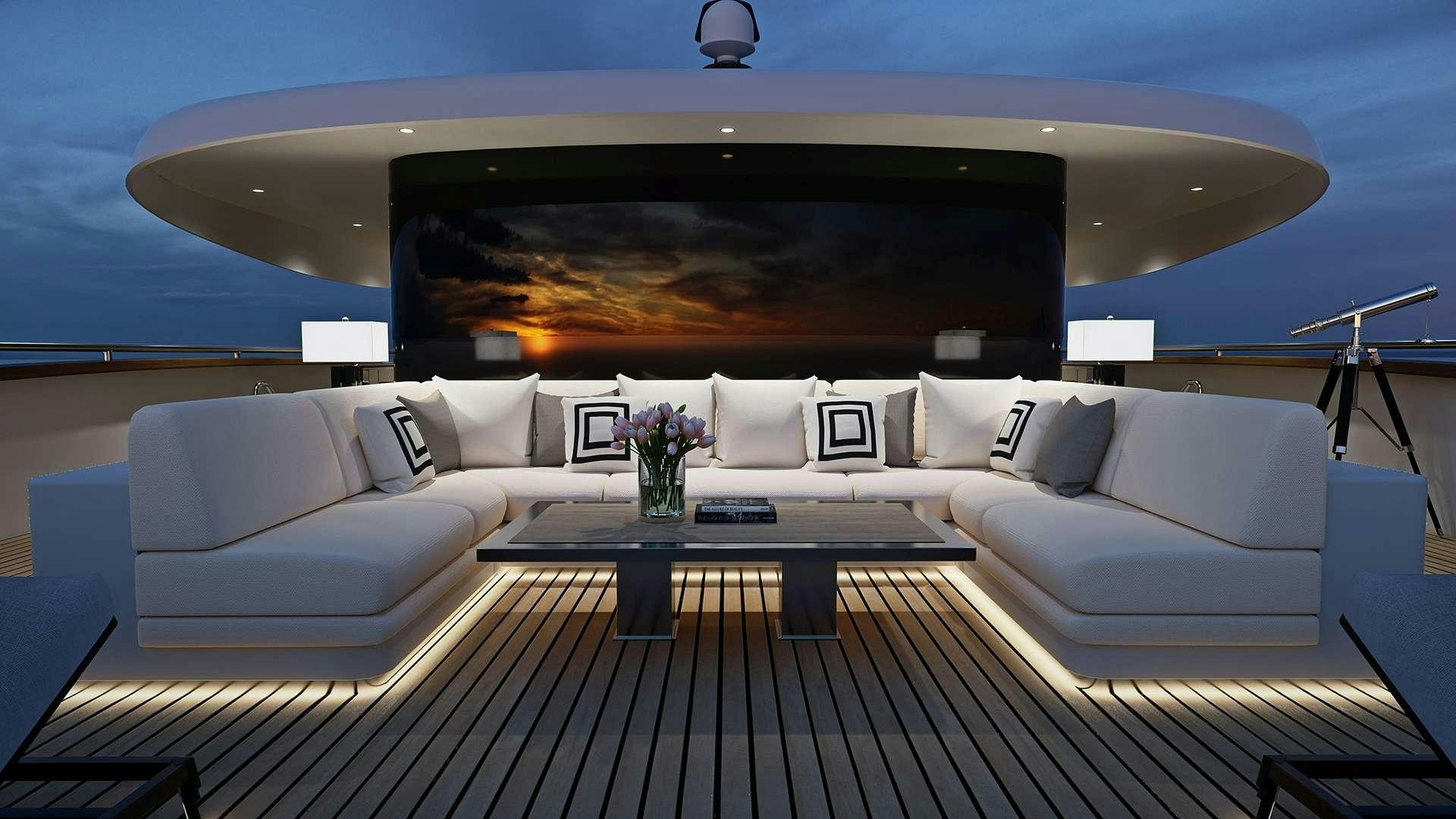 a large white sofa with a large screen above it aboard BLACK SWAN Yacht for Charter