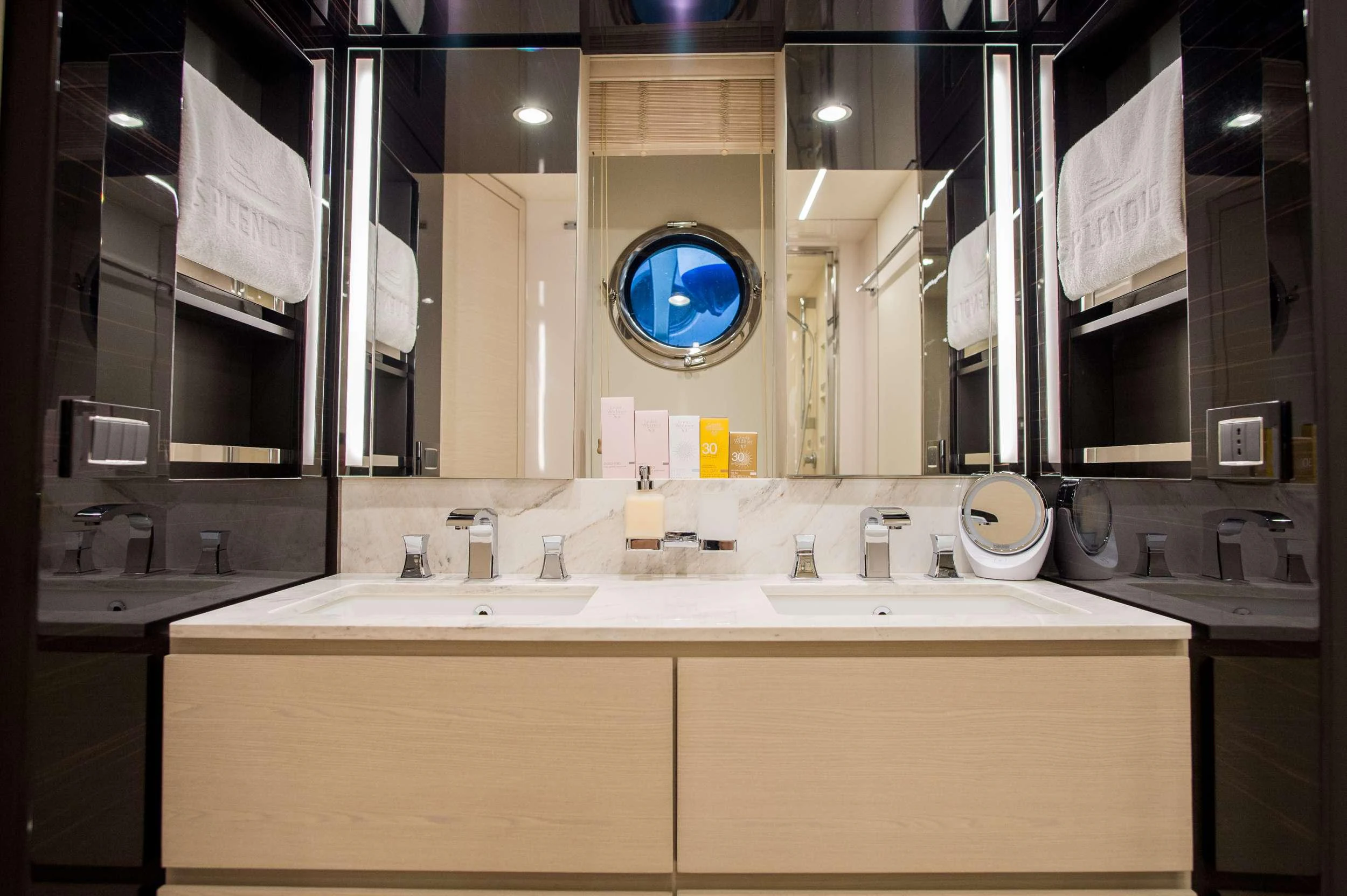 a bathroom with a large mirror aboard ALYSS Yacht for Charter