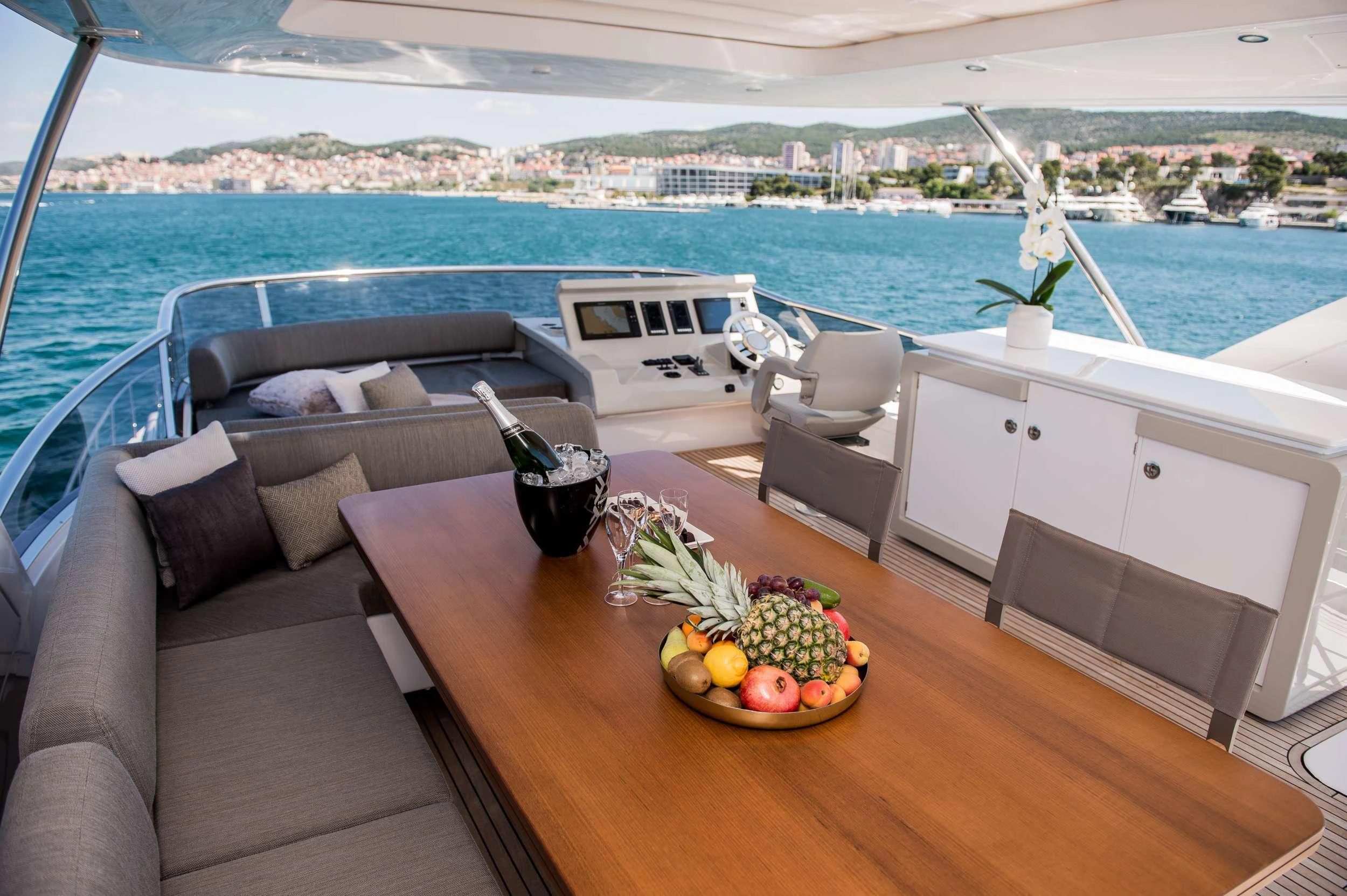 a table with fruit on it aboard ALYSS Yacht for Charter