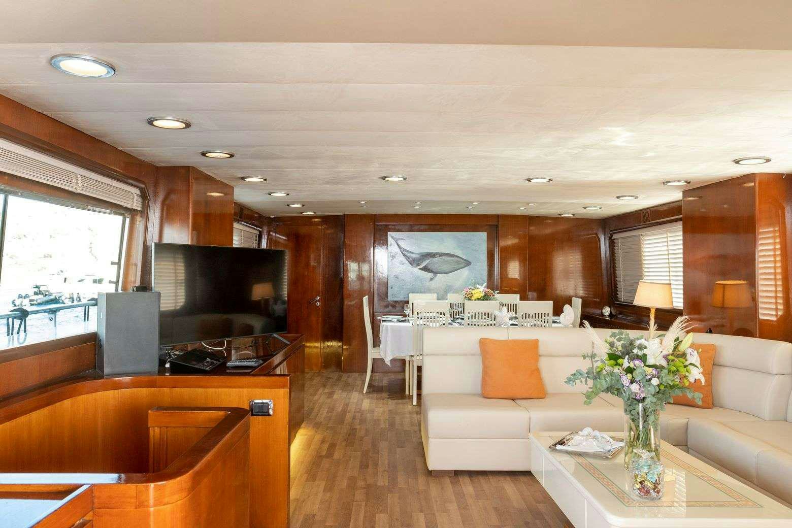 a living room with a large window aboard SHIVA Yacht for Charter