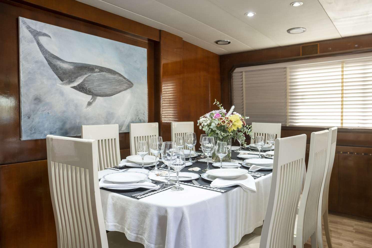 a table set for a formal dinner aboard SHIVA Yacht for Charter