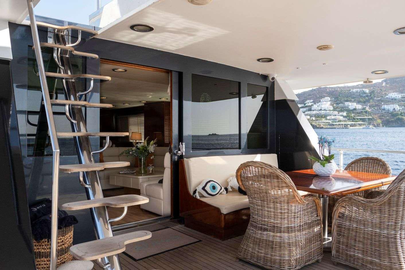 a room with a table and chairs aboard SHIVA Yacht for Charter