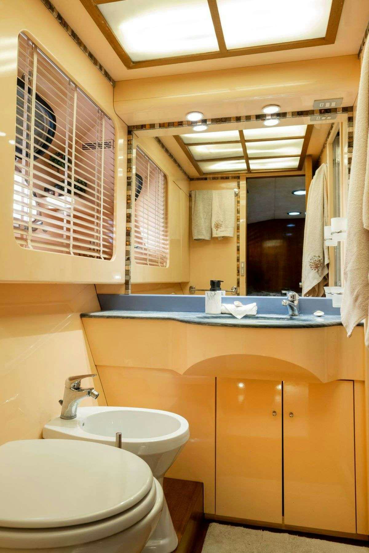 a bathroom with a sink and a toilet aboard SHIVA Yacht for Charter
