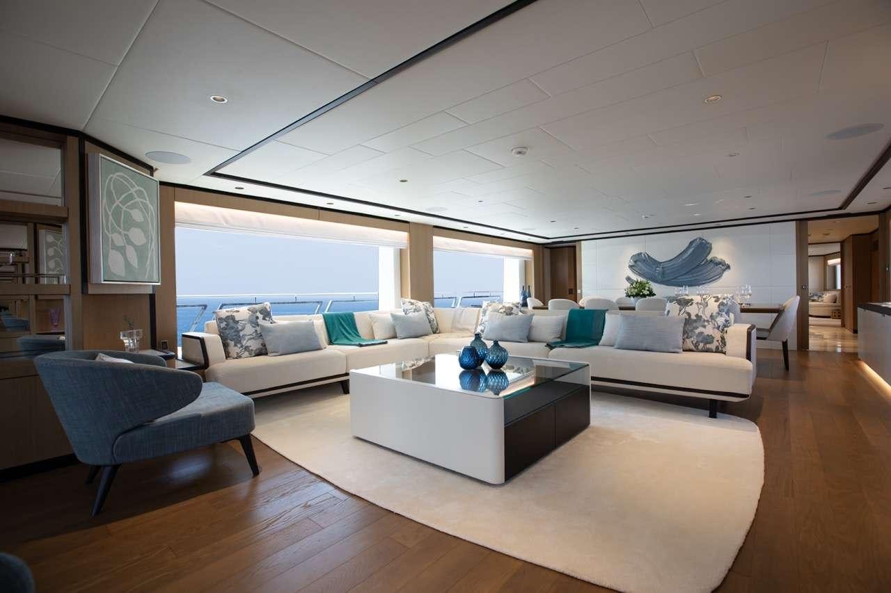 a living room with a large window aboard OLIVIA Yacht for Charter