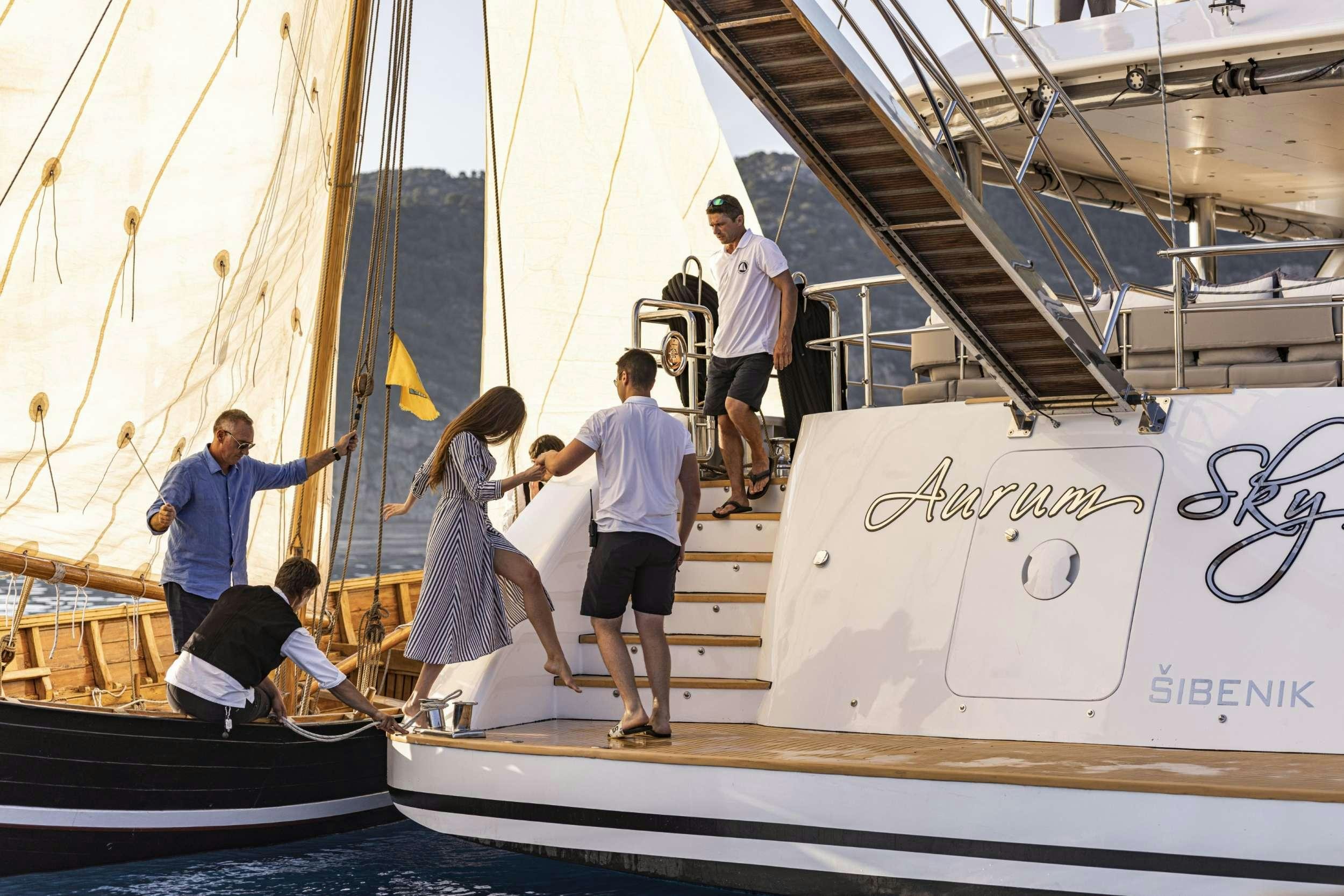 a group of people on a boat aboard M/S AURUM SKY Yacht for Charter