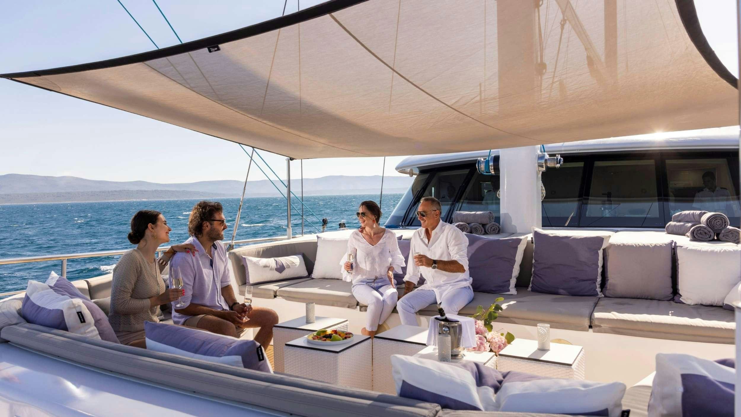 a group of people sitting on a boat aboard M/S AURUM SKY Yacht for Charter