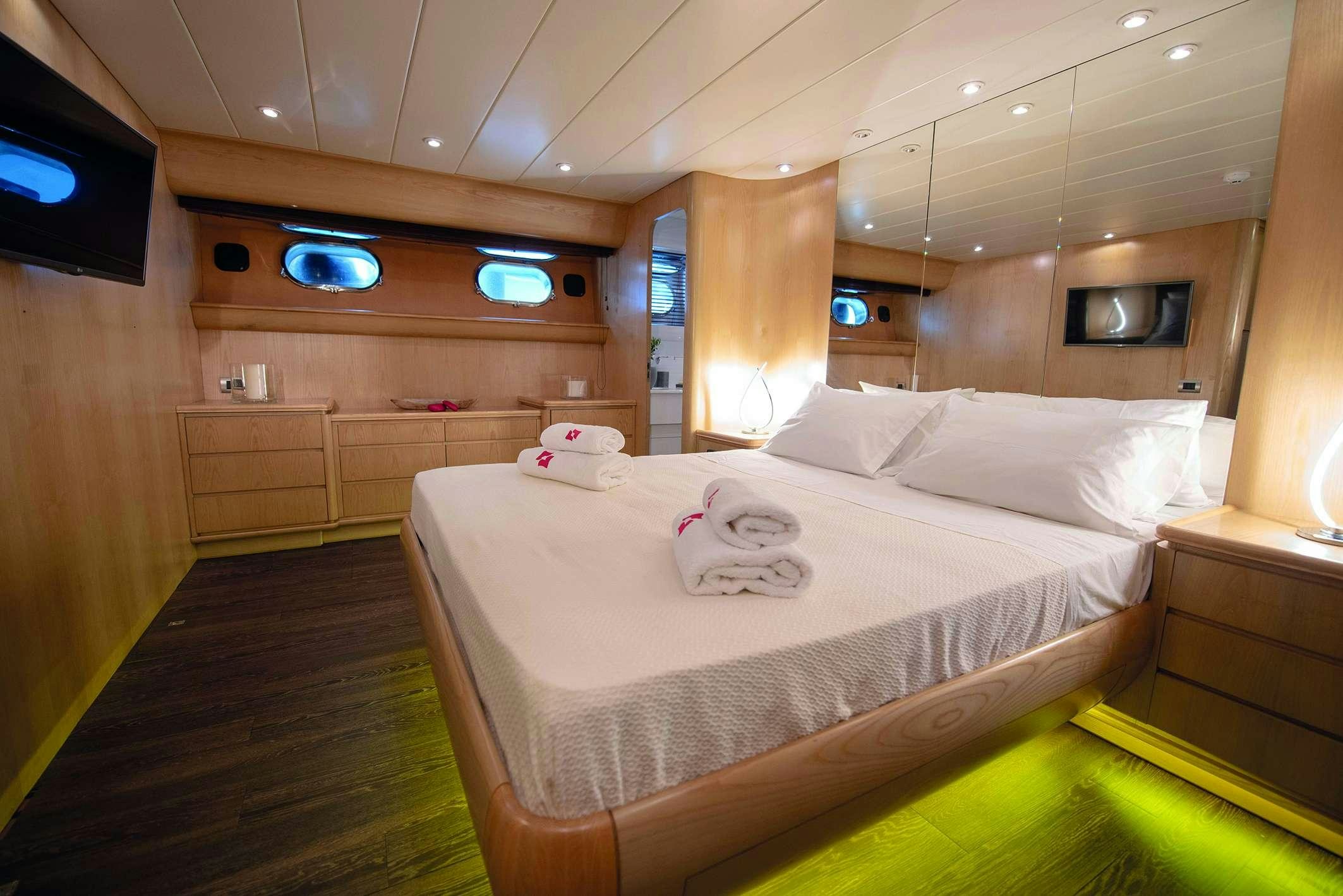 a bed in a room aboard KISS Yacht for Charter