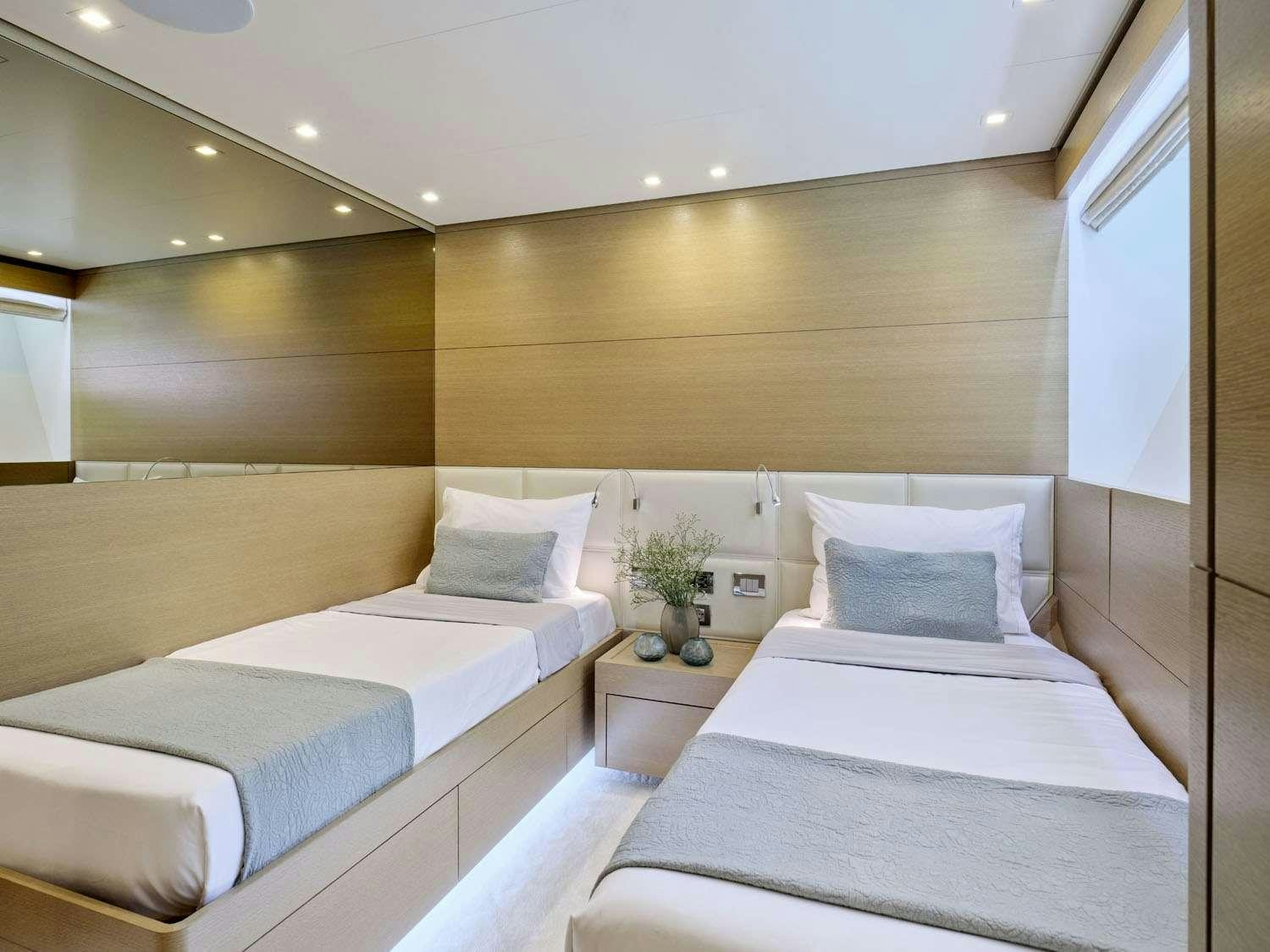 a room with two beds aboard FLOR Yacht for Charter