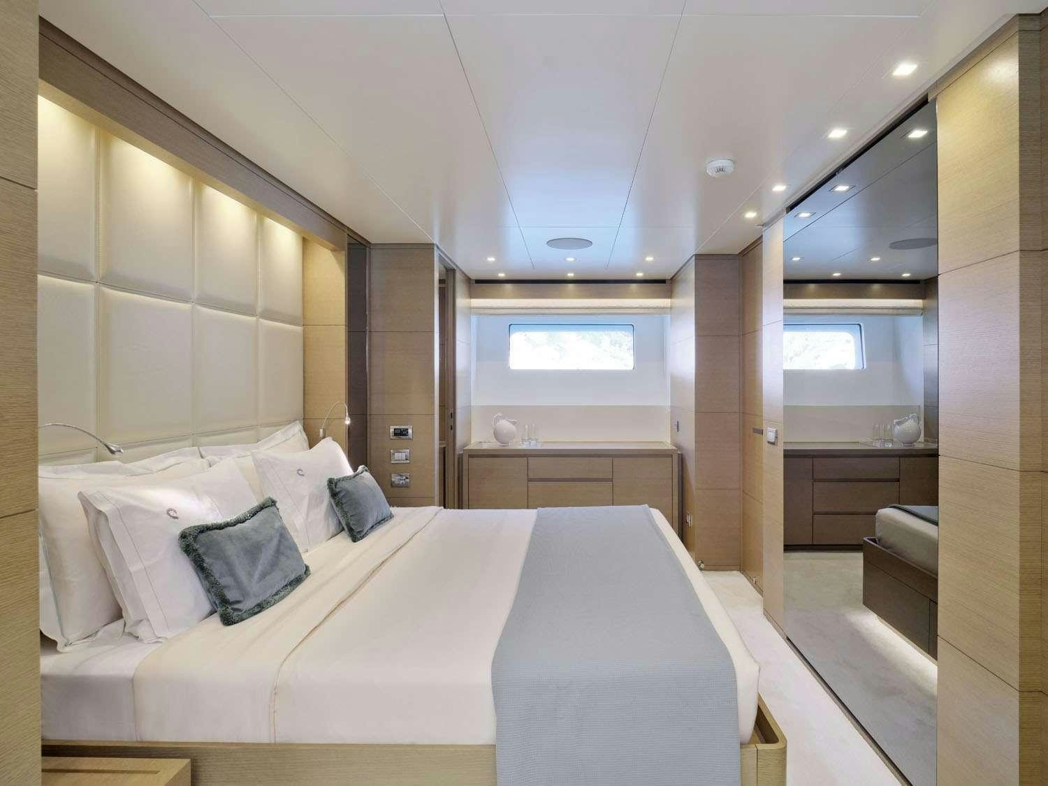 a bed in a room aboard FLOR Yacht for Charter