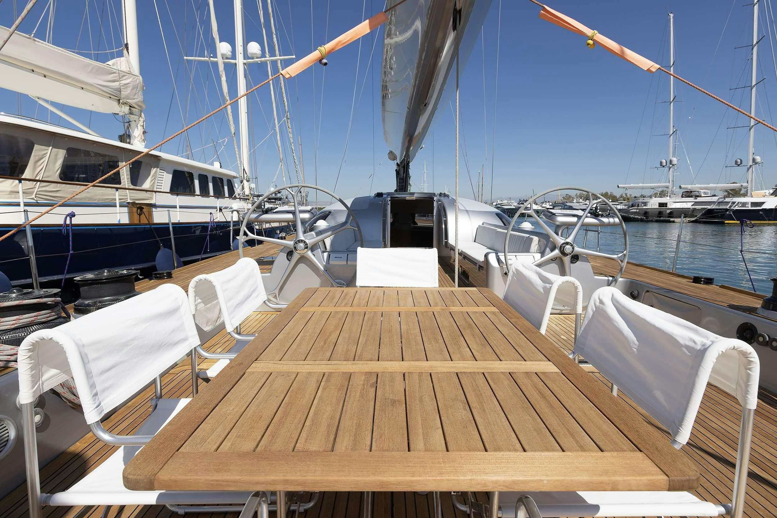 a boat dock with many boats aboard MELITI Yacht for Charter