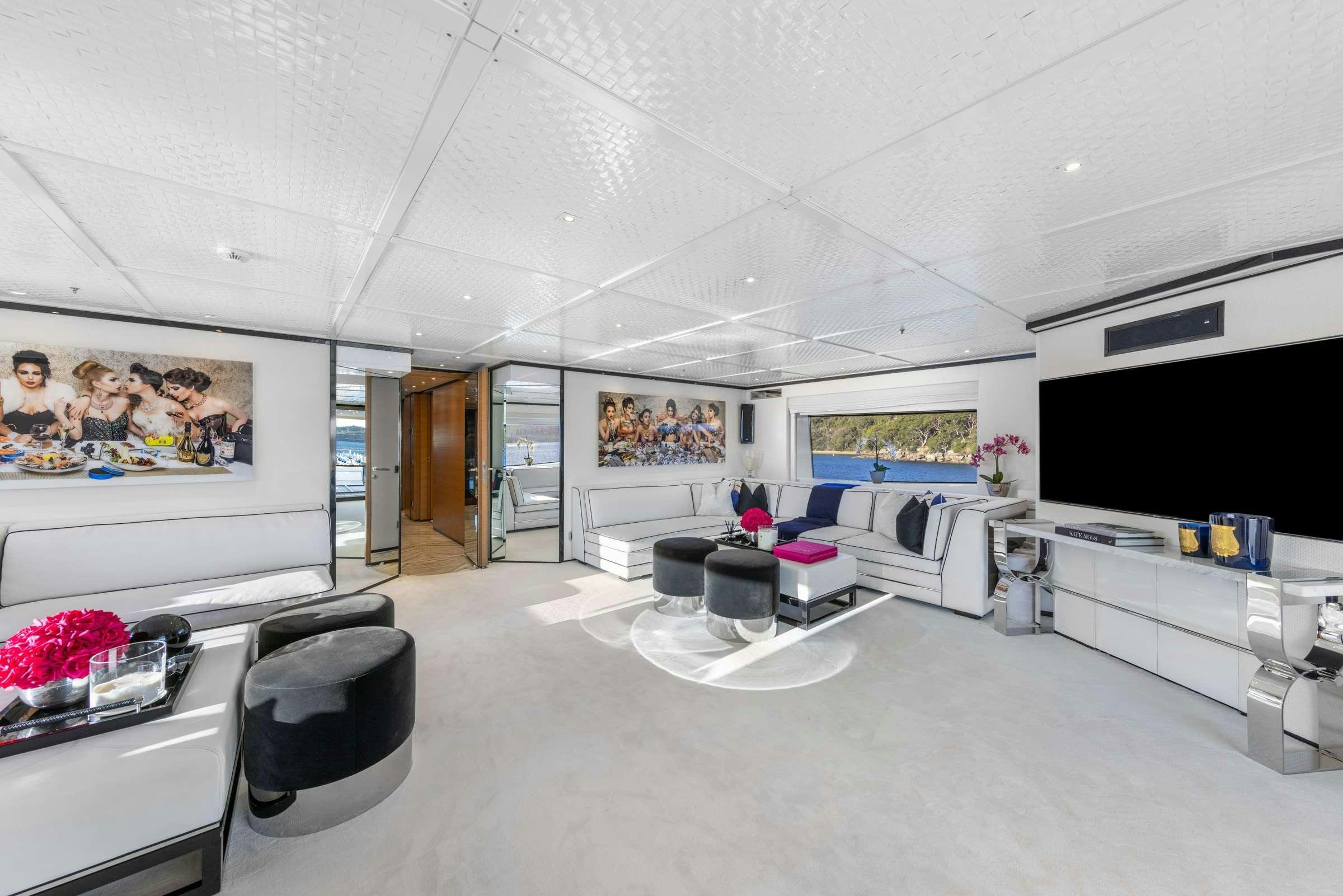 a room with a table and chairs aboard MISCHIEF 1 Yacht for Charter
