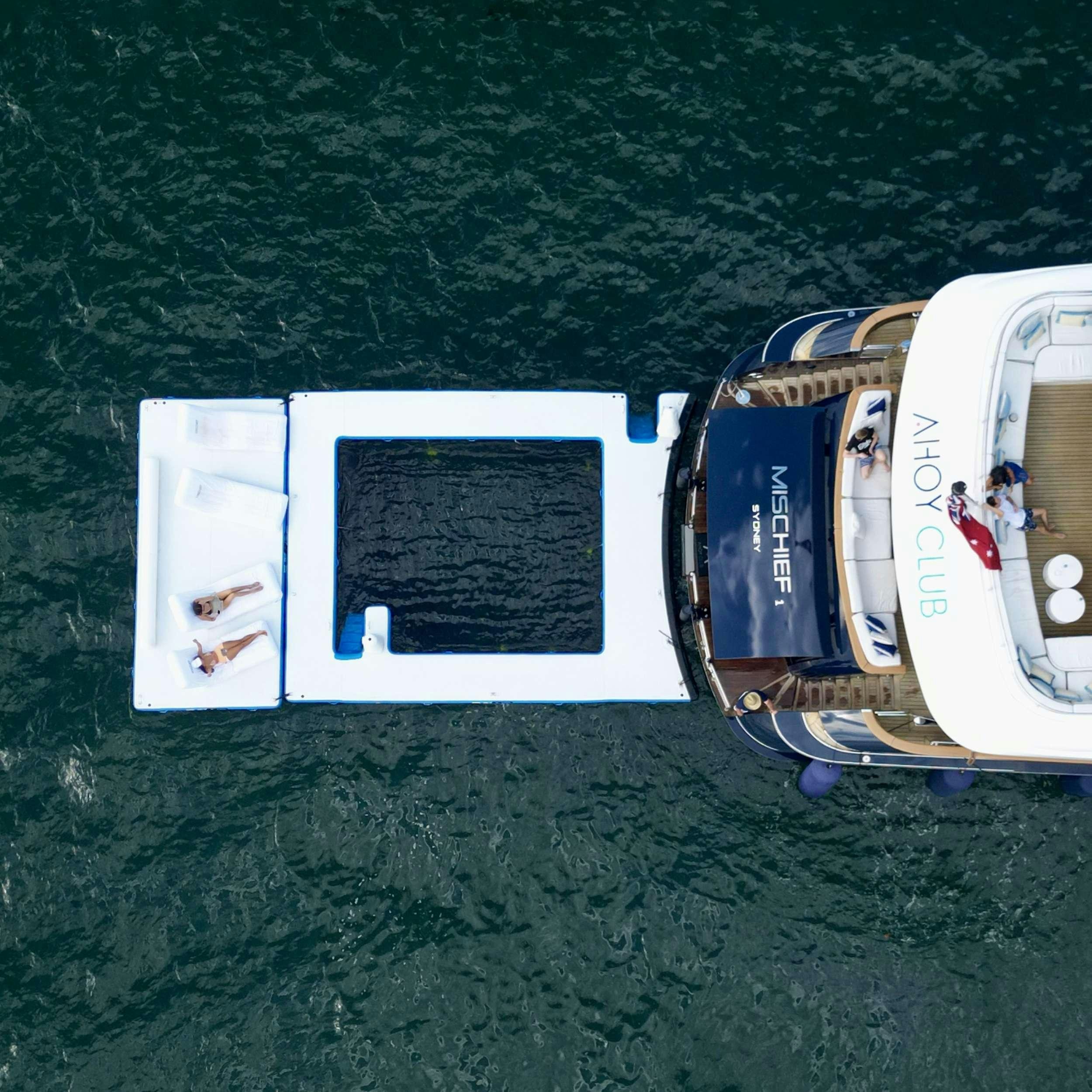 a group of white boxes on a carpet aboard MISCHIEF 1 Yacht for Charter