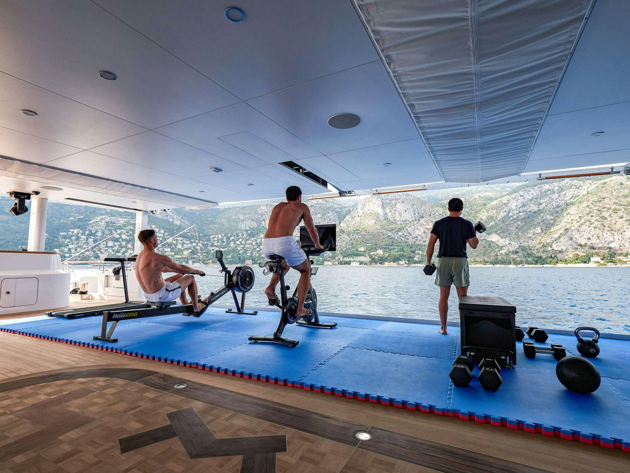 a group of men on a boat aboard CORAL OCEAN Yacht for Charter