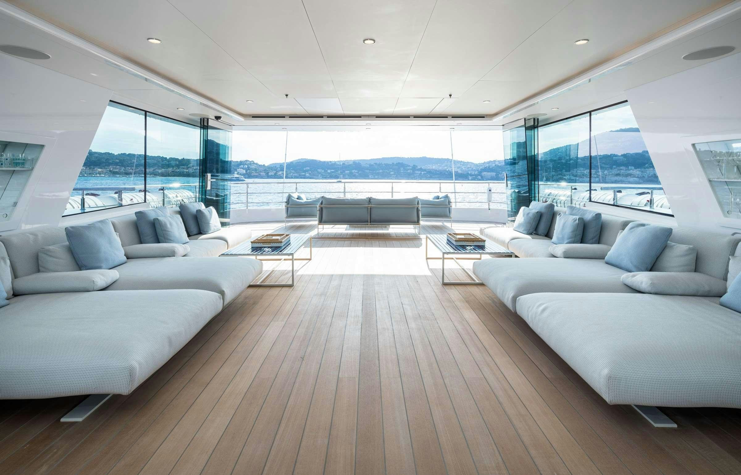 a large living room with a large window aboard CORAL OCEAN Yacht for Charter
