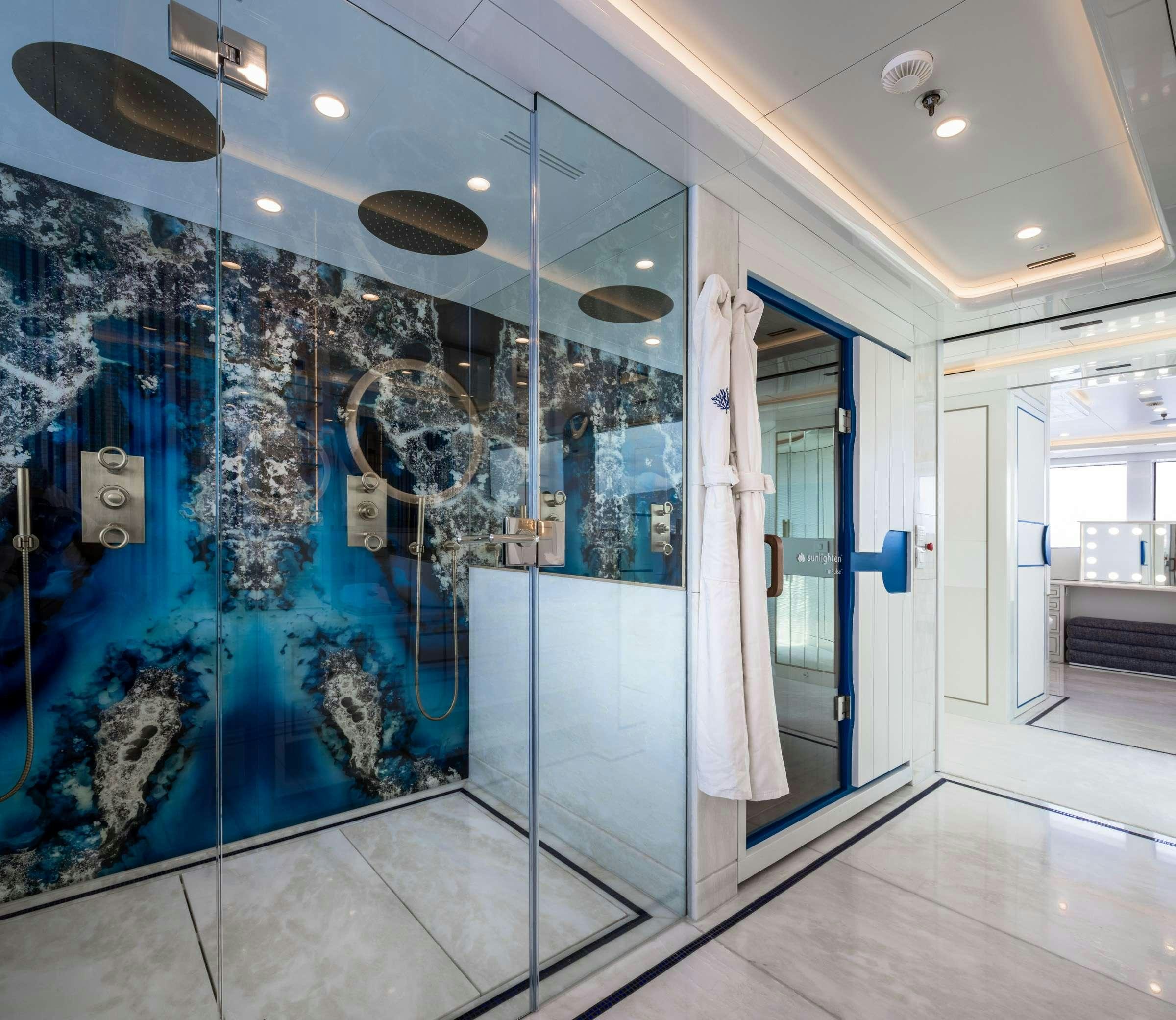 a large bathroom with a glass wall aboard CORAL OCEAN Yacht for Charter