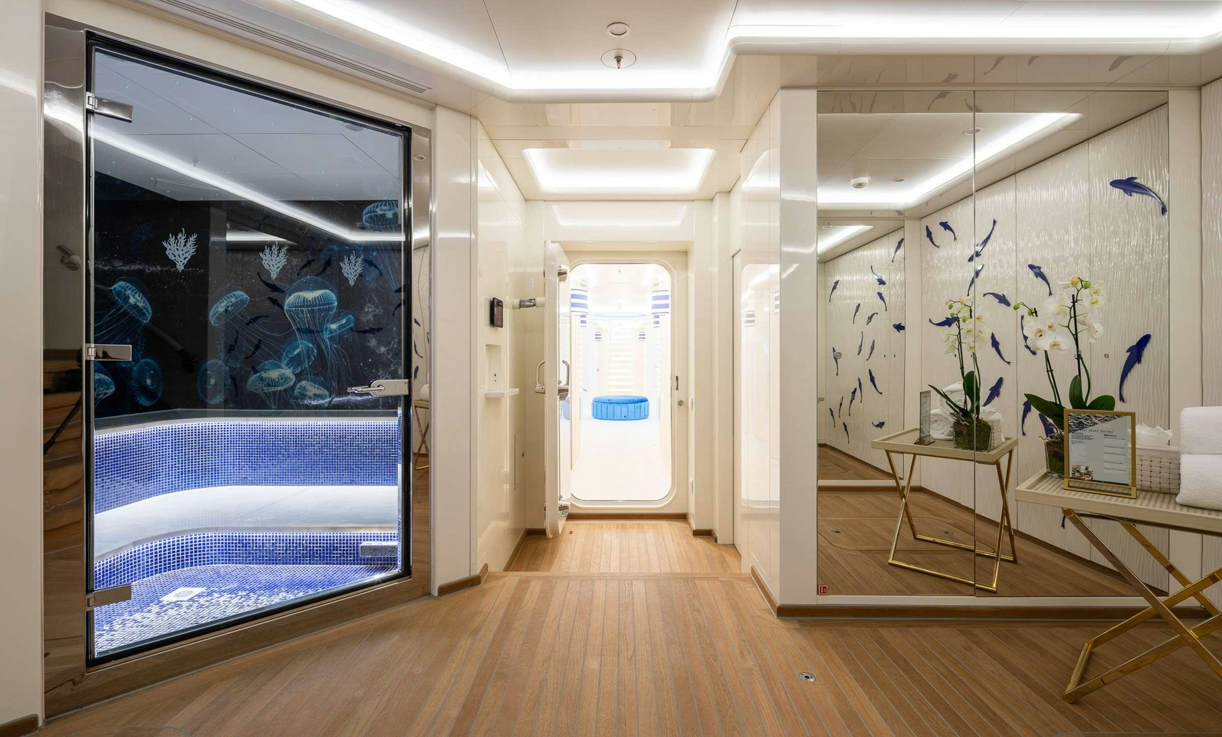 a room with a large glass door aboard CORAL OCEAN Yacht for Charter