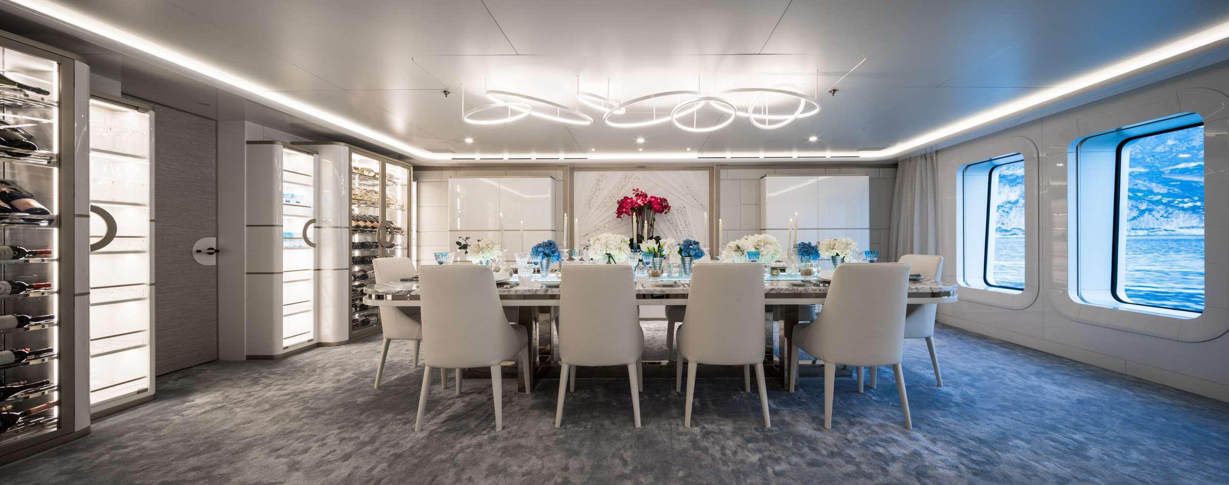 a room with a table chairs and a window aboard CORAL OCEAN Yacht for Charter