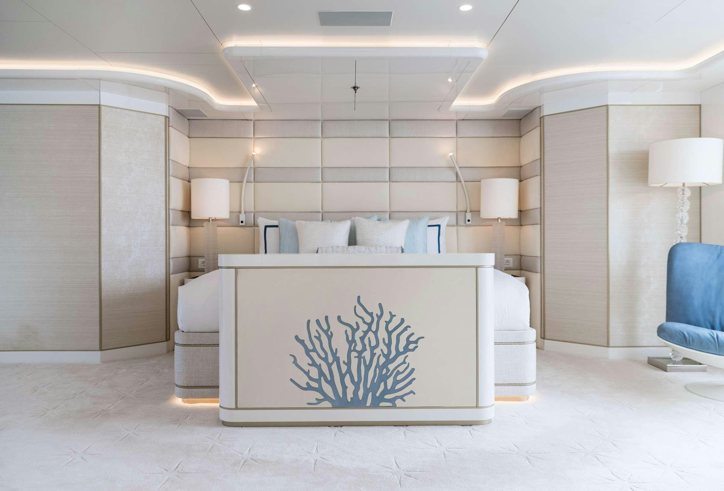 a room with a large white counter and chairs aboard CORAL OCEAN Yacht for Charter