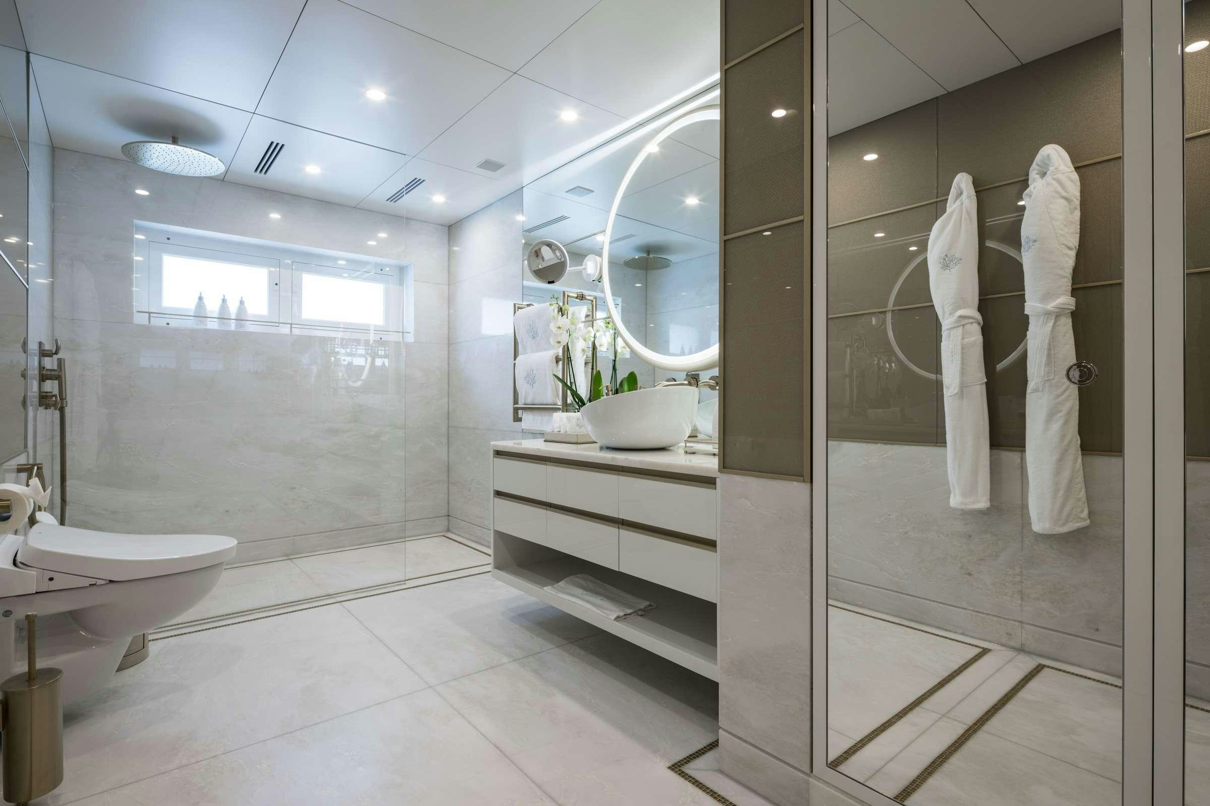a bathroom with a large glass shower aboard CORAL OCEAN Yacht for Charter