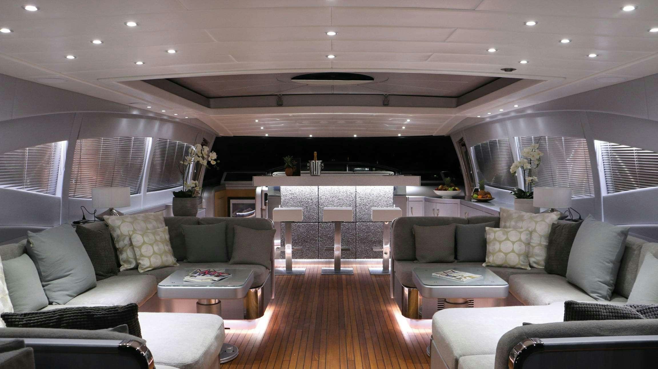 a living room with a large window aboard JFF Yacht for Charter