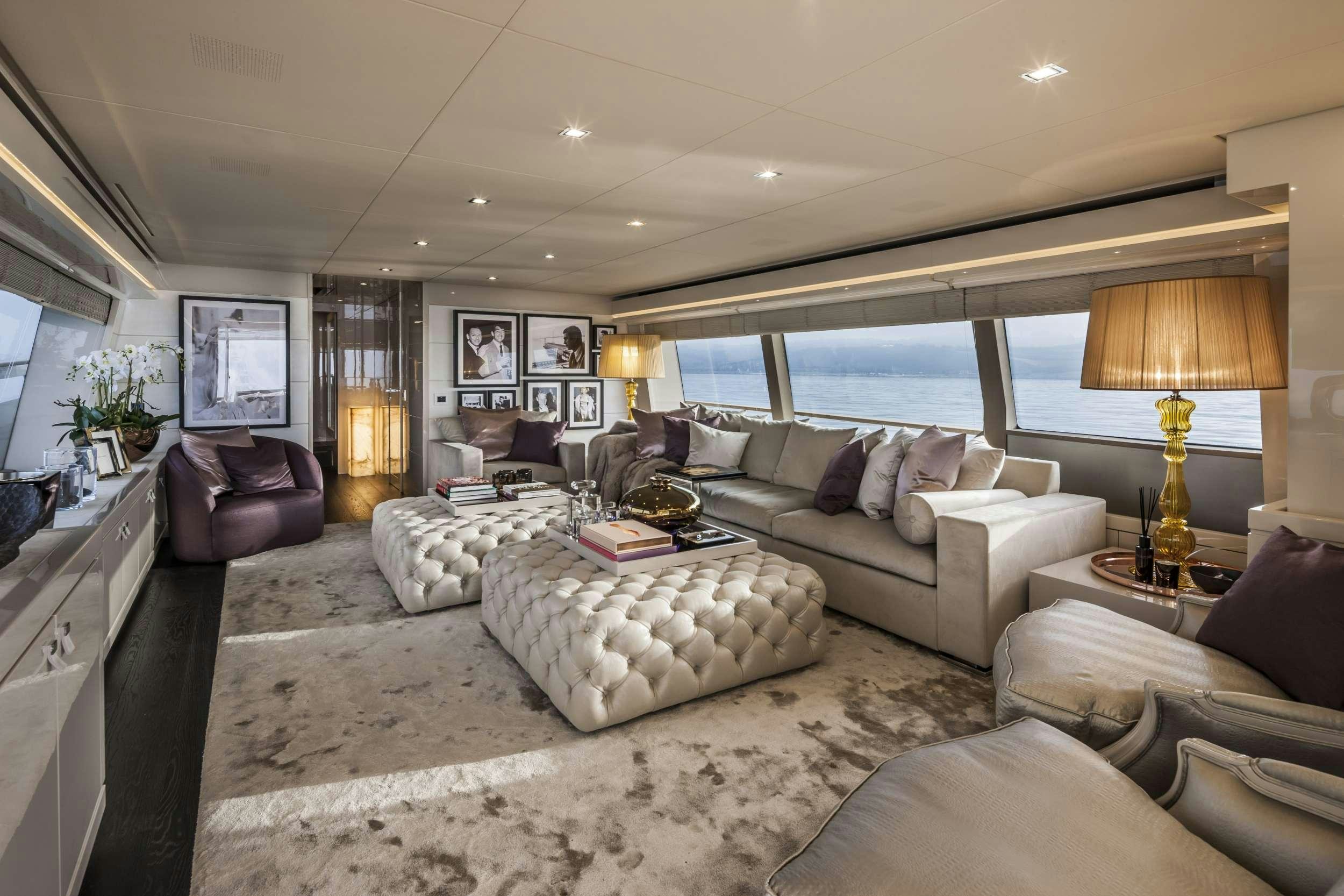 a living room with a large window aboard YVONNE Yacht for Charter