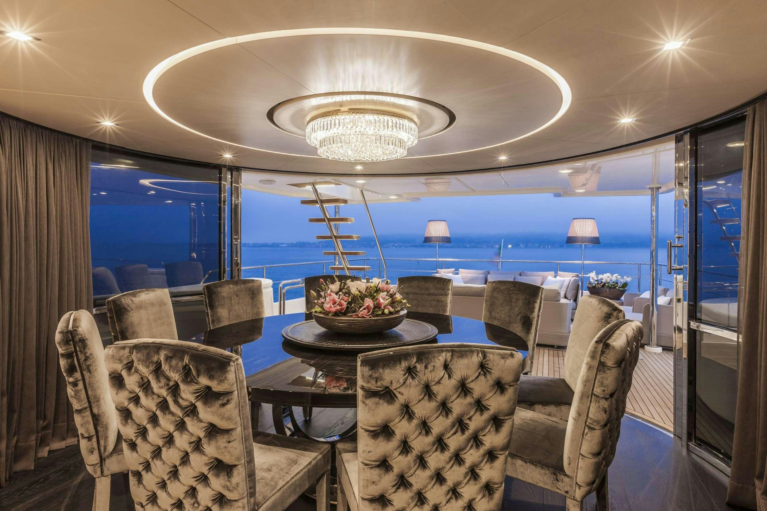 a room with a table and chairs aboard YVONNE Yacht for Charter