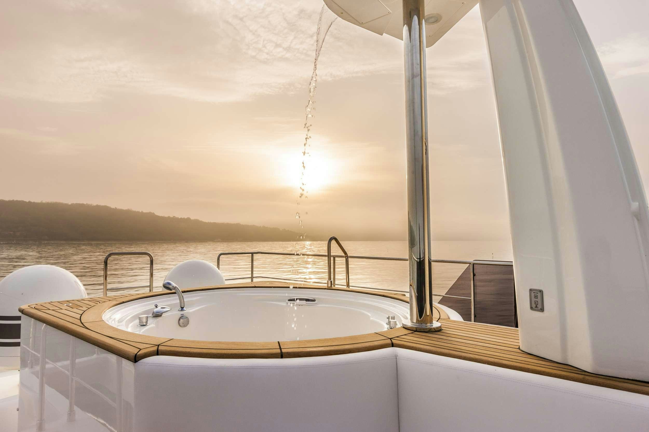 a bathtub with a sink aboard YVONNE Yacht for Charter