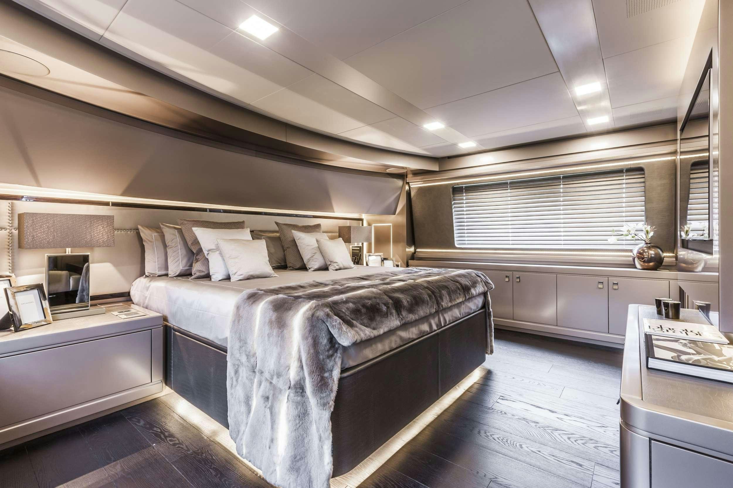 a large bedroom with a bed aboard YVONNE Yacht for Charter