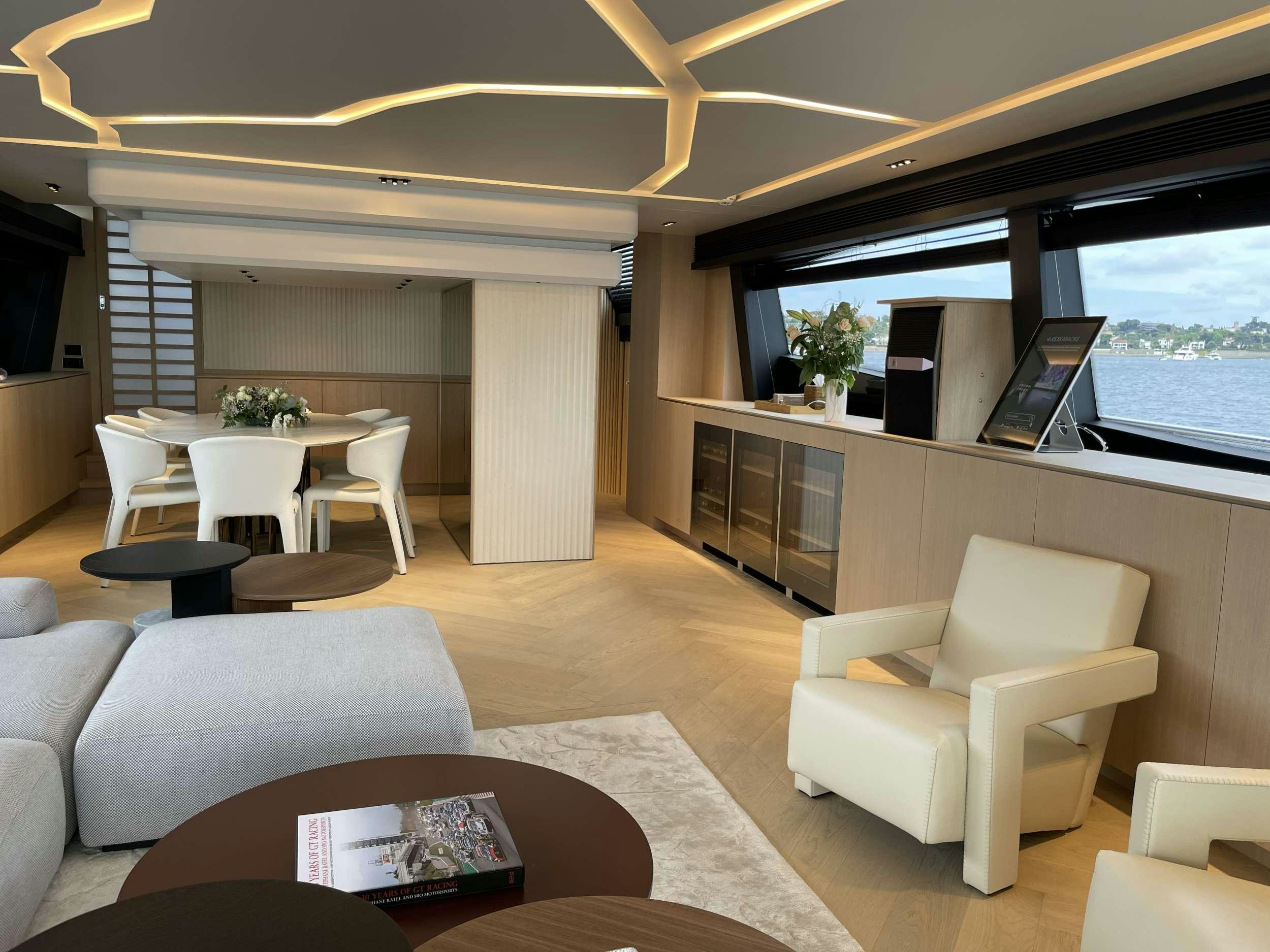 a modern looking living room aboard FERRETTI 881 RPH Yacht for Charter