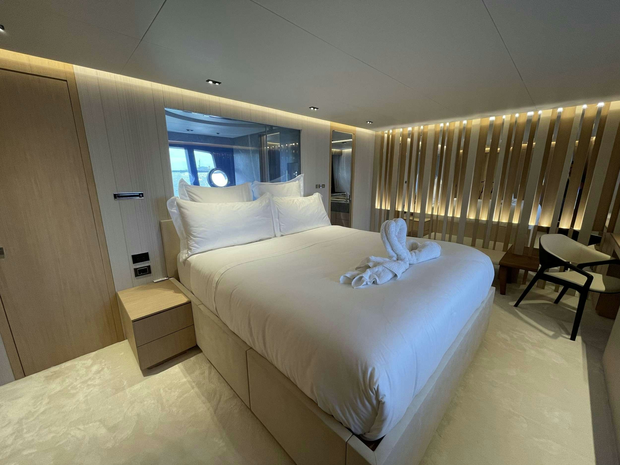 a room with two beds aboard FERRETTI 881 RPH Yacht for Charter