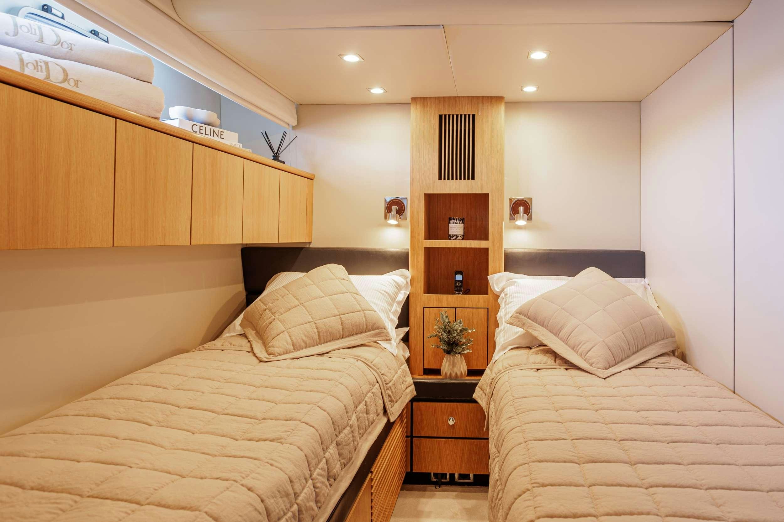 a room with two beds aboard JOLIDOR Yacht for Charter