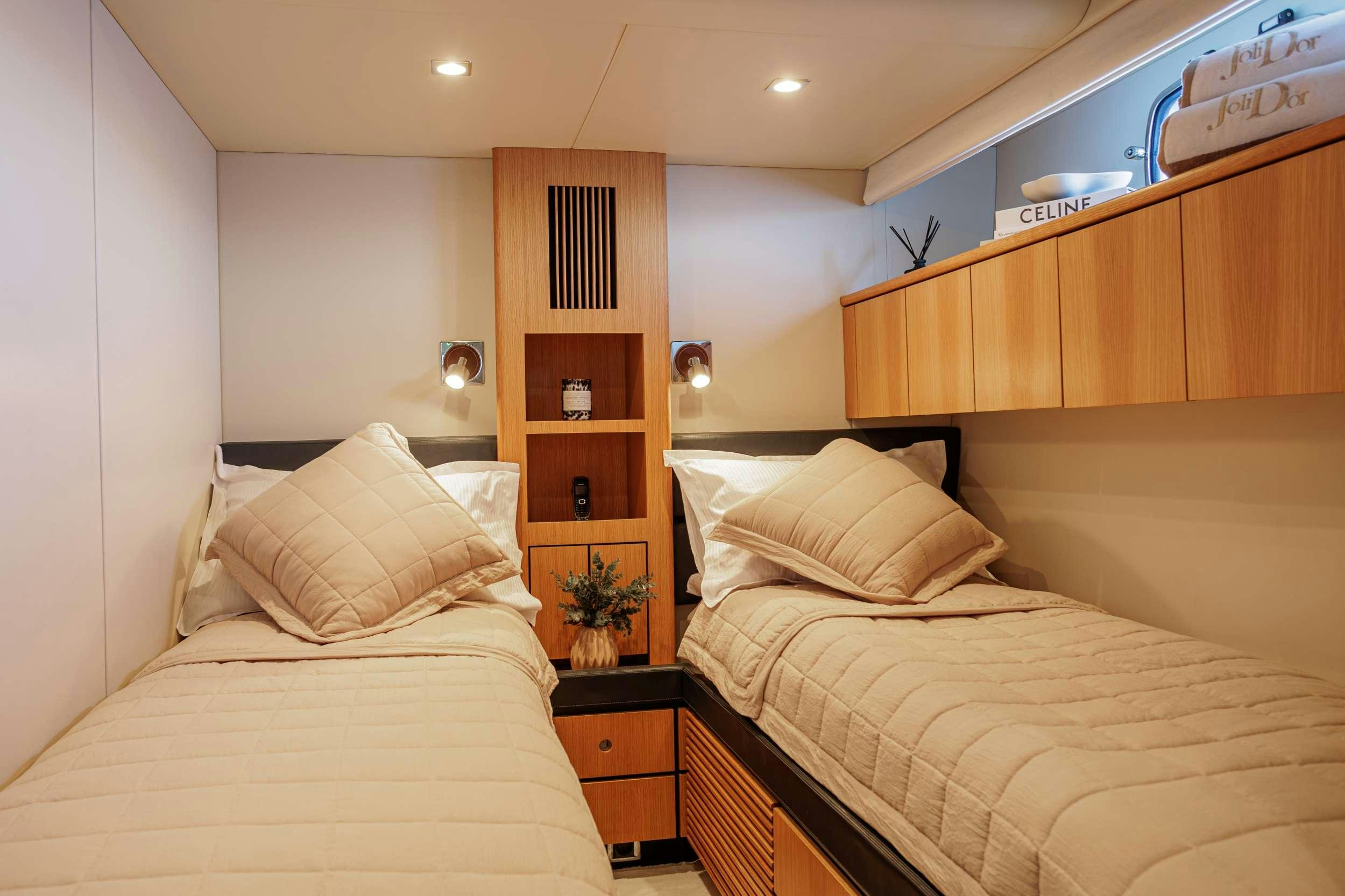 a room with two beds aboard JOLIDOR Yacht for Charter