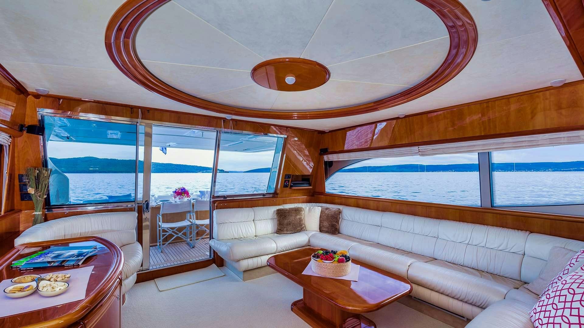 a living room with a large window aboard M/Y MARINO Yacht for Charter