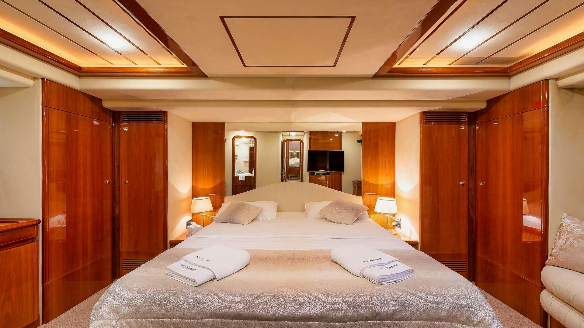 a large bed in a hotel room aboard M/Y MARINO Yacht for Charter