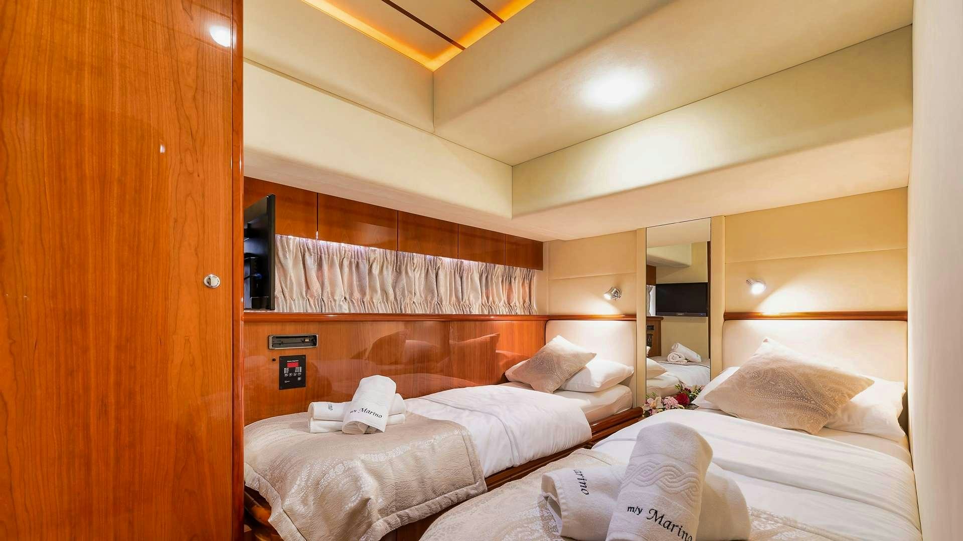 a room with a bed and a closet aboard M/Y MARINO Yacht for Charter