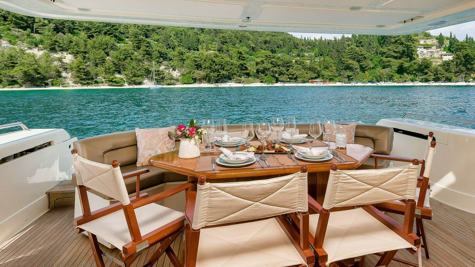 a table set for a meal on a boat aboard M/Y MARINO Yacht for Charter