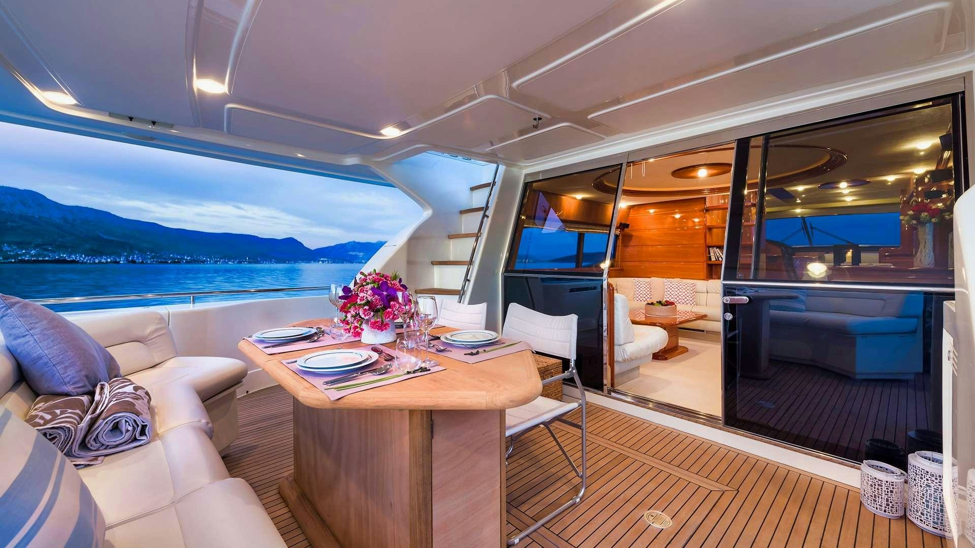a room with a table and chairs aboard M/Y MARINO Yacht for Charter