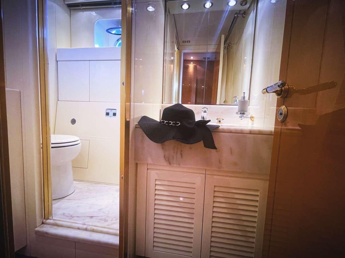 a bathroom with a large mirror aboard CIKILA Yacht for Charter