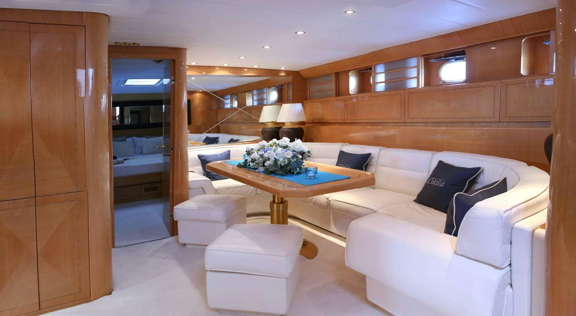 a room with a couch and a table aboard CIKILA Yacht for Charter