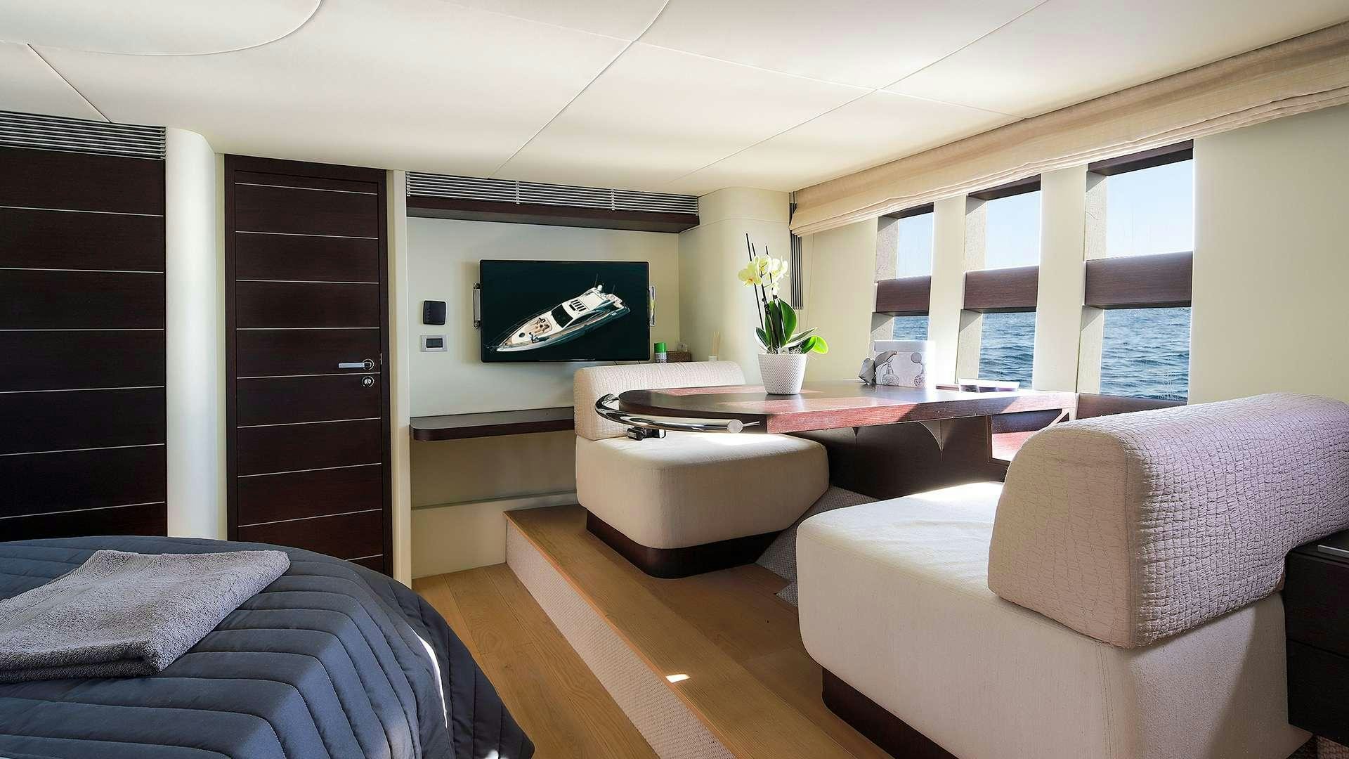 a room with a couch and a television aboard M/Y MAORO Yacht for Charter