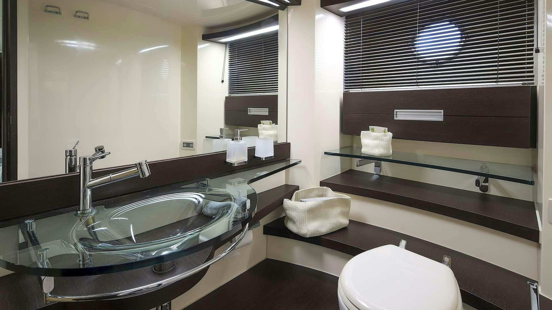 a bathroom with a sink and a mirror aboard M/Y MAORO Yacht for Charter