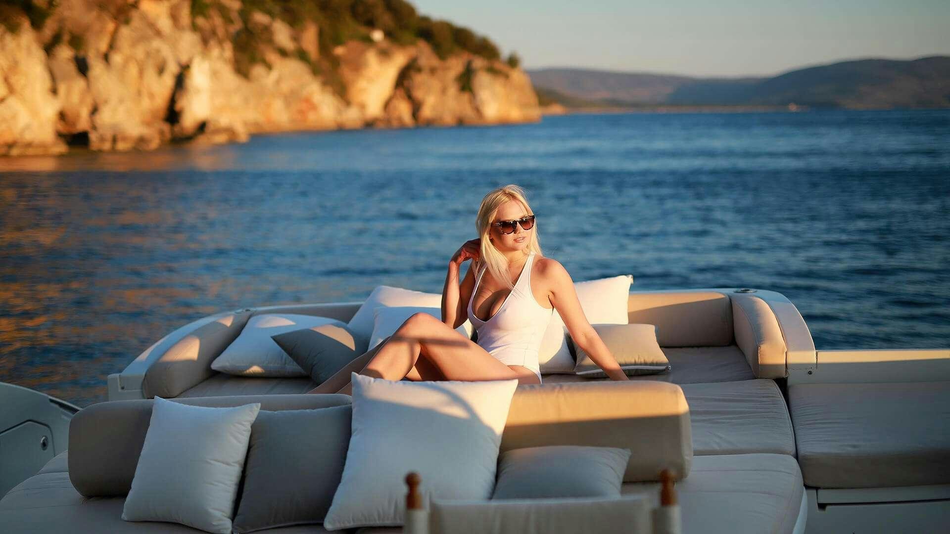a person sitting on a boat aboard M/Y MAORO Yacht for Charter