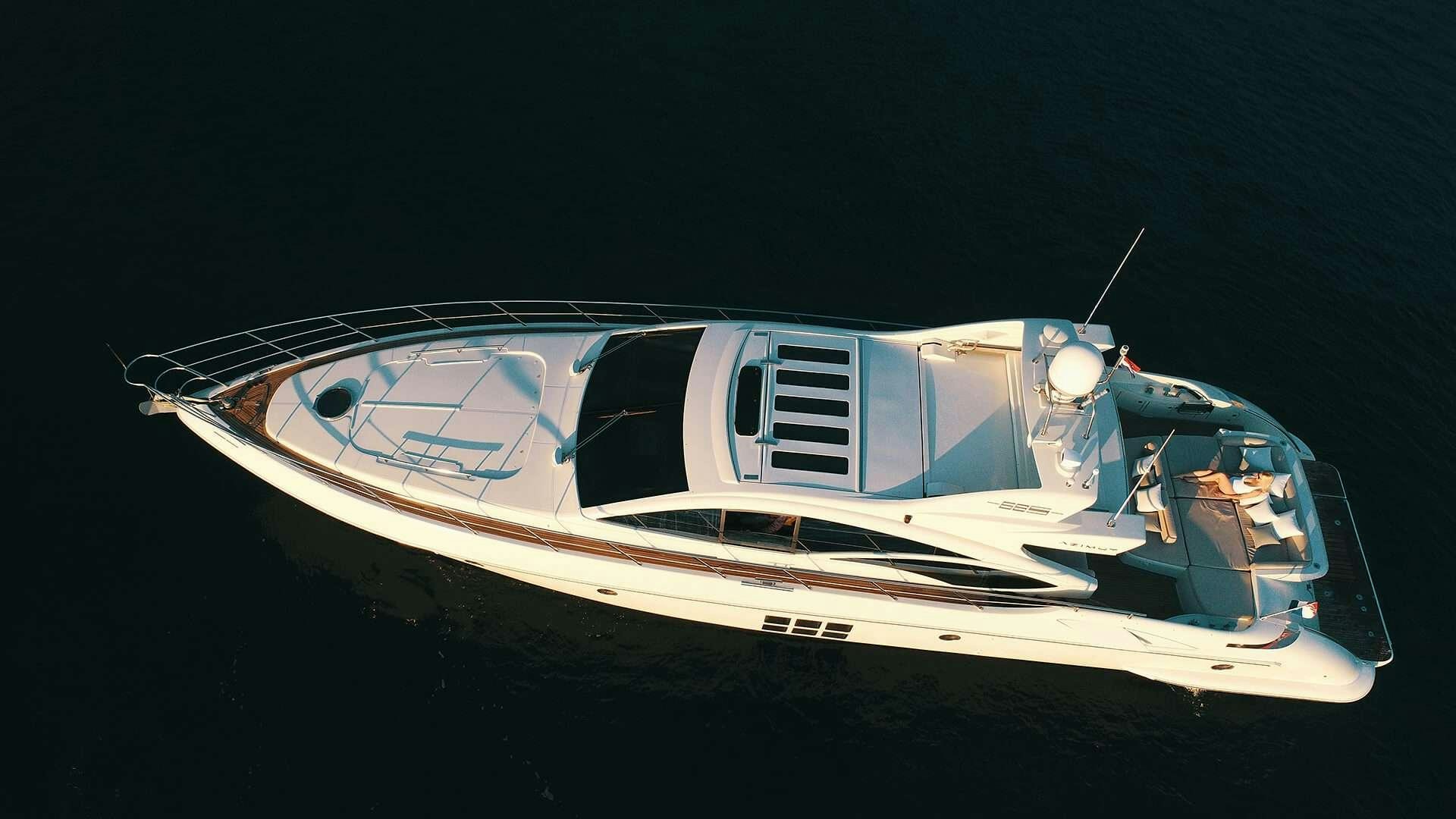 a white and blue boat aboard M/Y MAORO Yacht for Charter