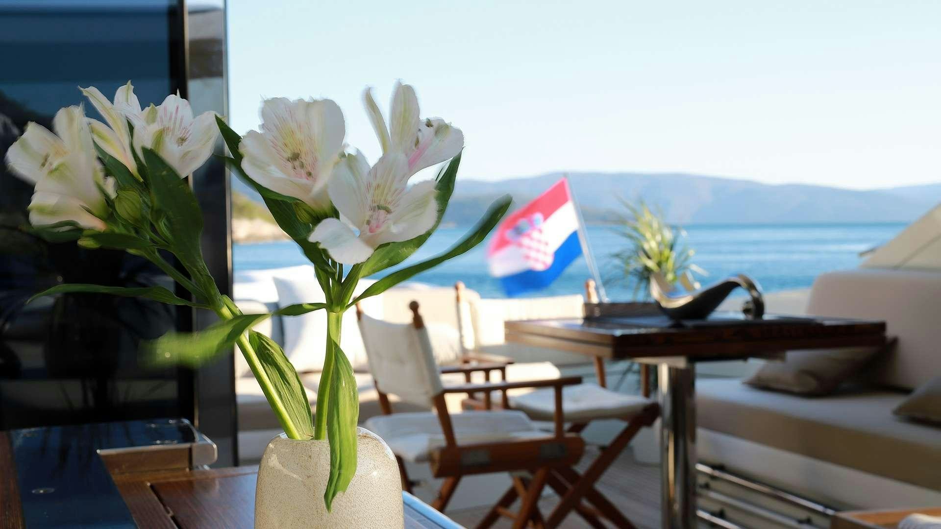 a vase with white flowers aboard M/Y MAORO Yacht for Charter