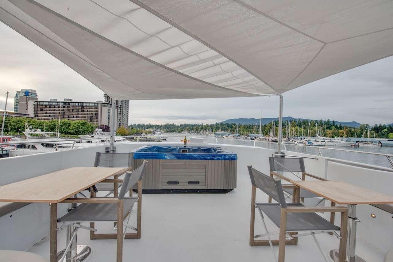 a room with tables and chairs aboard ASCENTE Yacht for Charter