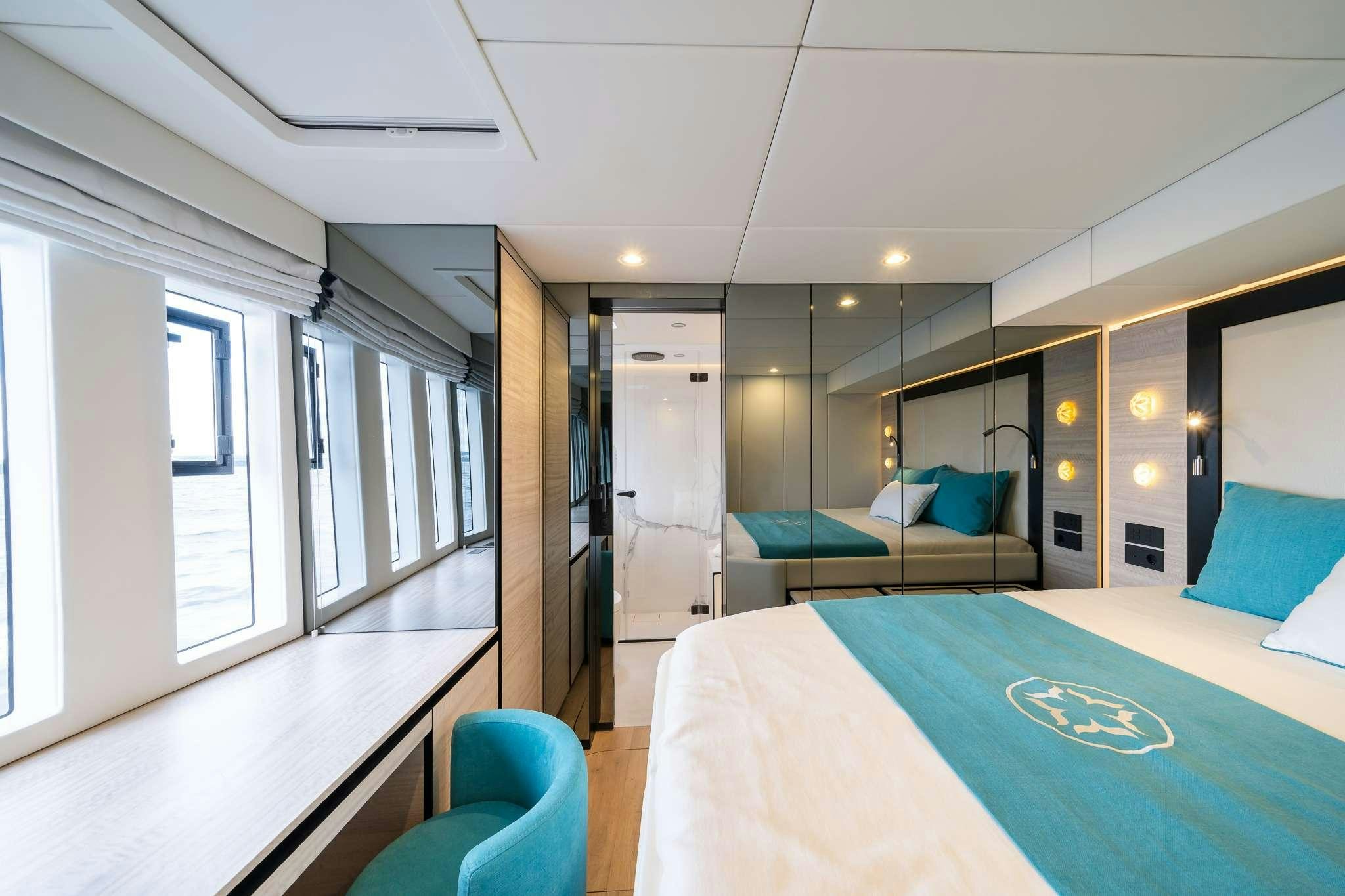 a room with a pool table and chairs aboard ONE PLANET Yacht for Charter