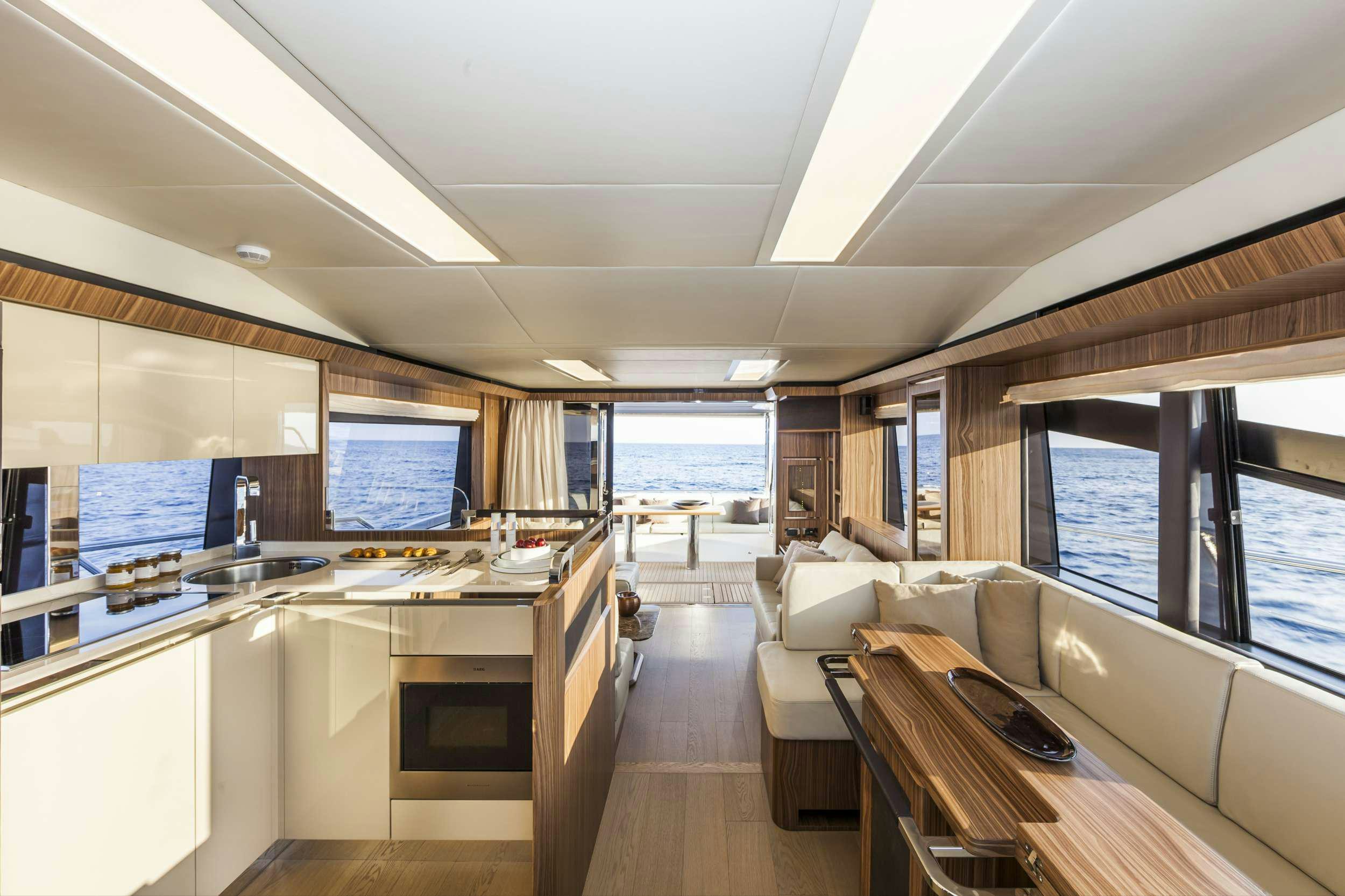 a room with a couch and a table with a computer on it aboard ABSOLUTE Yacht for Charter